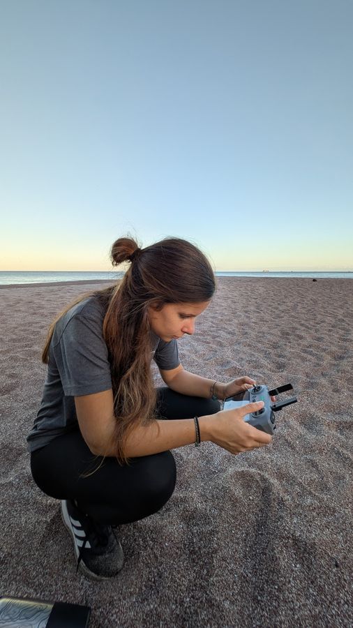 Volunteer operating a drone on the beach in Costa Rica